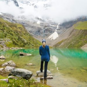 • Humantay Lake with turquoise water surrounded by snow-capped mountains near Cusco